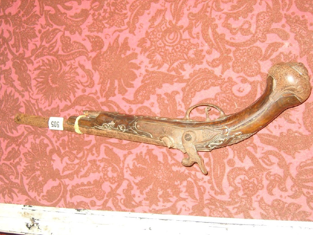 Appraisal: A Georgian percussion cap pistol carved walnut stock and applied