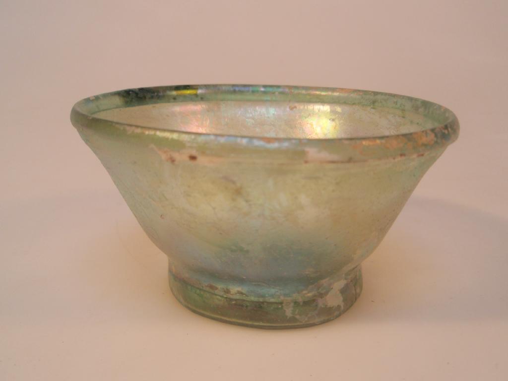 Appraisal: A bluish-green Roman glass bowl the straight flaring walls and