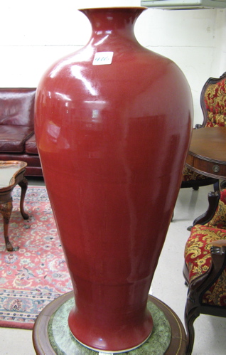 Appraisal: CHINESE RED POTTERY FLOOR VASE of tall bottle form with