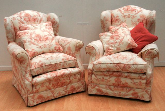 Appraisal: A pair of wingback armchairs upholstered in French Toile