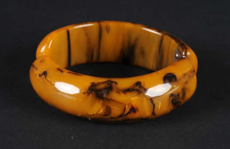 Appraisal: Bakelite Black Gold Swirl Hinged Bracelet Condition Excellent Size W