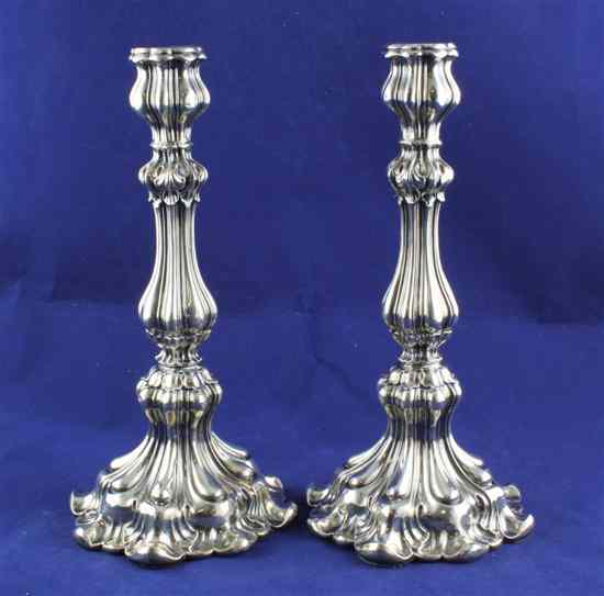 Appraisal: A pair of th century German repousse silver candlesticks of