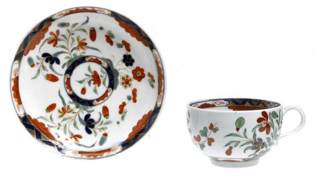 Appraisal: A WORCESTER IMARI TEACUP AND A SAUCER enamelled with the