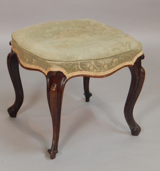 Appraisal: A Victorian rosewood stool with a padded seat on cabriole