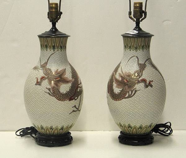 Appraisal: A pair of enameled porcelain vases th Century Both with