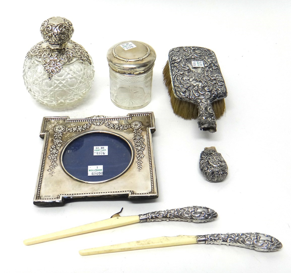 Appraisal: Silver and silver mounted wares comprising a shaped rectangular photograph