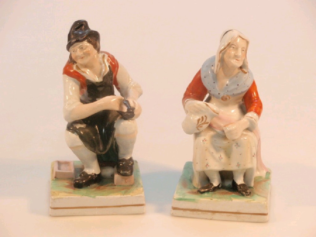 Appraisal: A pair of thC Staffordshire figures of a seated cobbler