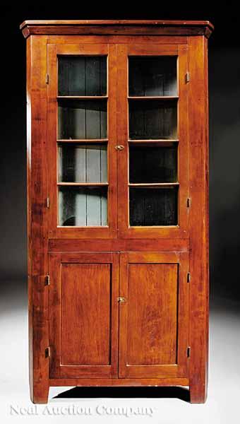 Appraisal: An Antique American Cherrywood Corner Cupboard mid- th c molded