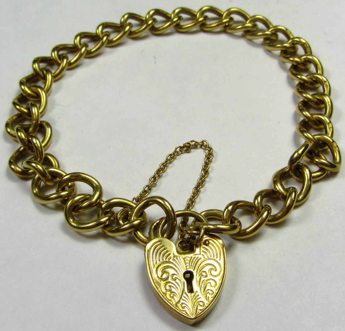 Appraisal: An ct gold curb link bracelet on an ct gold