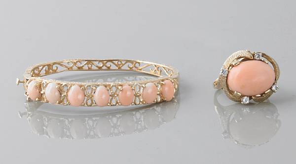 Appraisal: A coral and k gold bangle together with a coral