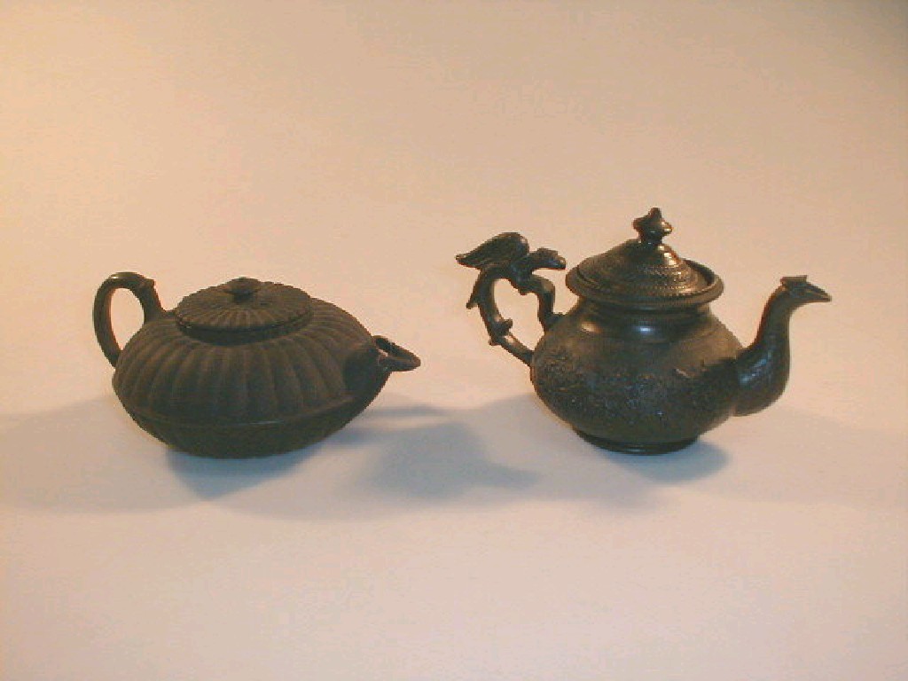 Appraisal: An early thC Cyples style black basalt teapot decorated with