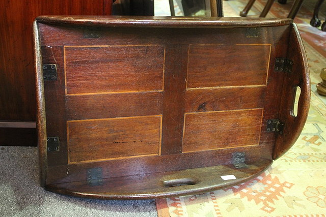 Appraisal: A TH CENTURY MAHOGANY BUTLER'S TRAY with four hinged handles