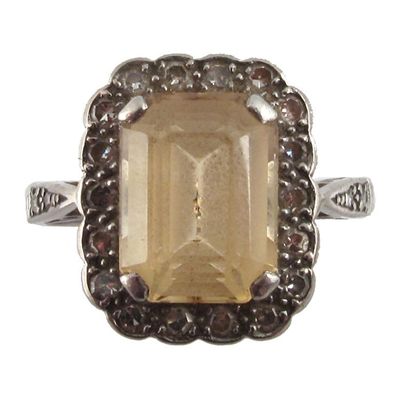 Appraisal: A yellow topaz and diamond cluster ring The emerald cut