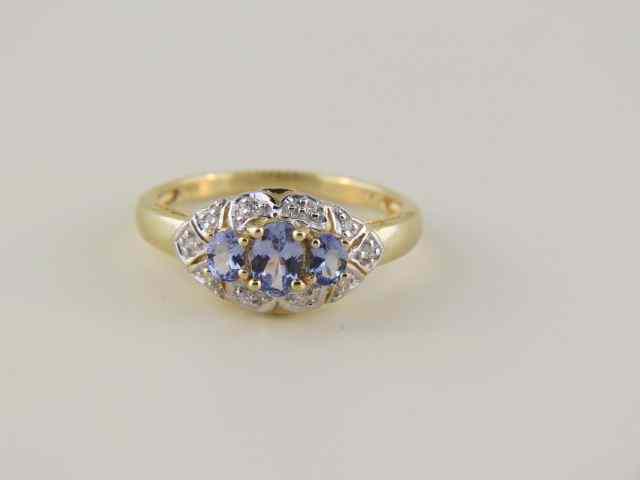 Appraisal: Tanzanite Diamond Ring oval gems surrounded by diamonds in k