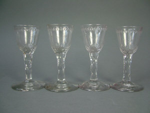 Appraisal: Four faceted stem wine glasses the bowls cut with stars