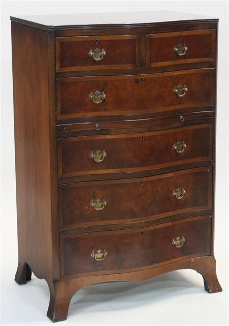 Appraisal: A Georgian style mahogany serpentine chest the crossbanded reeded top