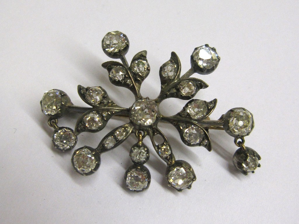 Appraisal: Edwardian bi colour gold diamond set flower brooch with old