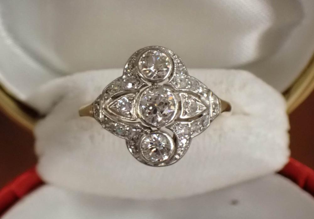 Appraisal: VINTAGE ESTATE DIAMOND AND EIGHTEEN KARAT WHITE YELLOW GOLD RING