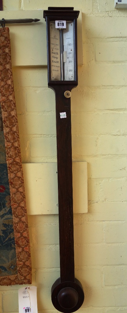 Appraisal: A Georgian rosewood stick barometer by J W Cooper Lynn