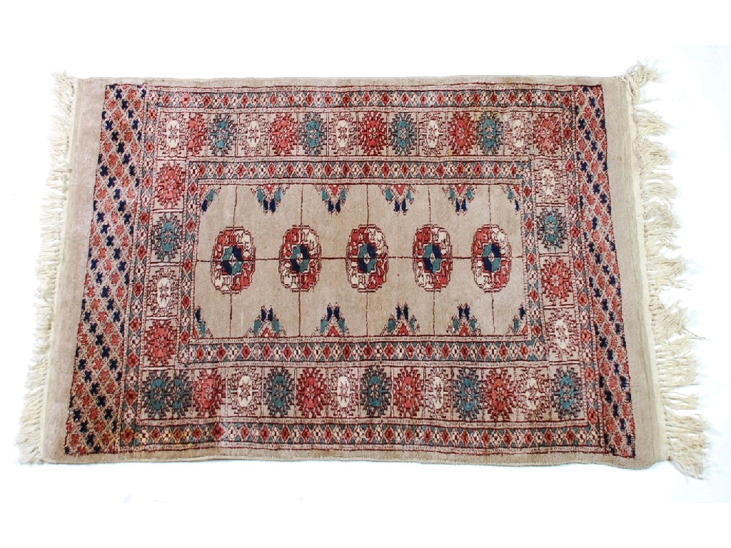 Appraisal: TWO VERY SIMILAR PAKISTAN 'BOKHARA' SMALL RUGS each with a