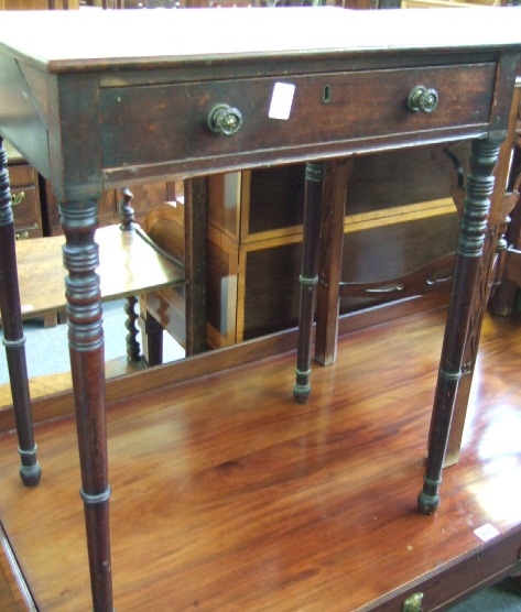 Appraisal: An early th century mahogany side table with single frieze