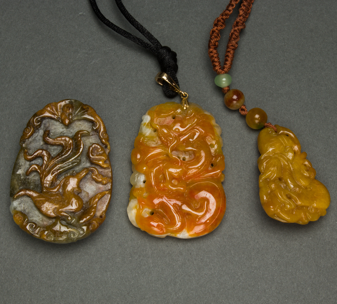 Appraisal: LOT OF CHINESE RUSSET JADEITE PENDANTS lot of Chinese russet