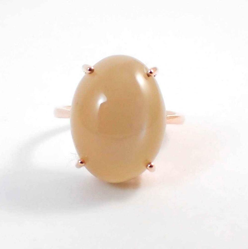 Appraisal: PEACH CAT'S EYE MOONSTONE AND FOURTEEN KARAT ROSE GOLD RING