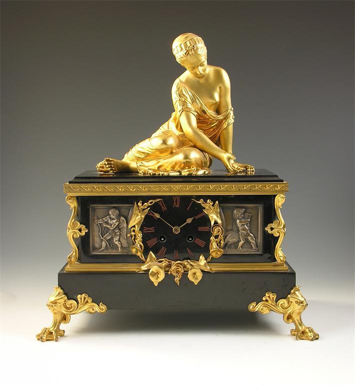 Appraisal: A th century French black marble and ormolu mantel clock