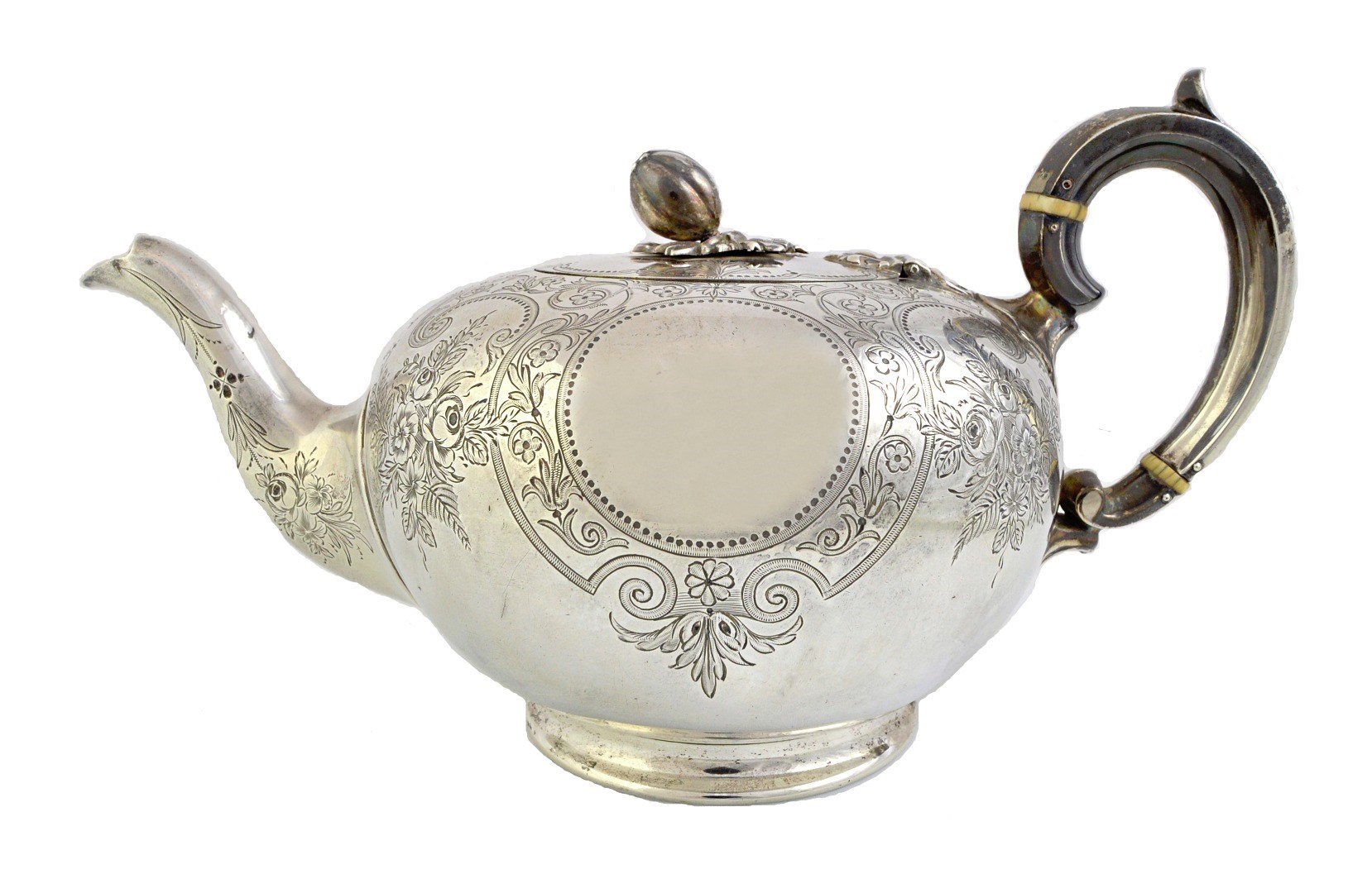 Appraisal: A Victorian silver teapot of compressed circular form with floral