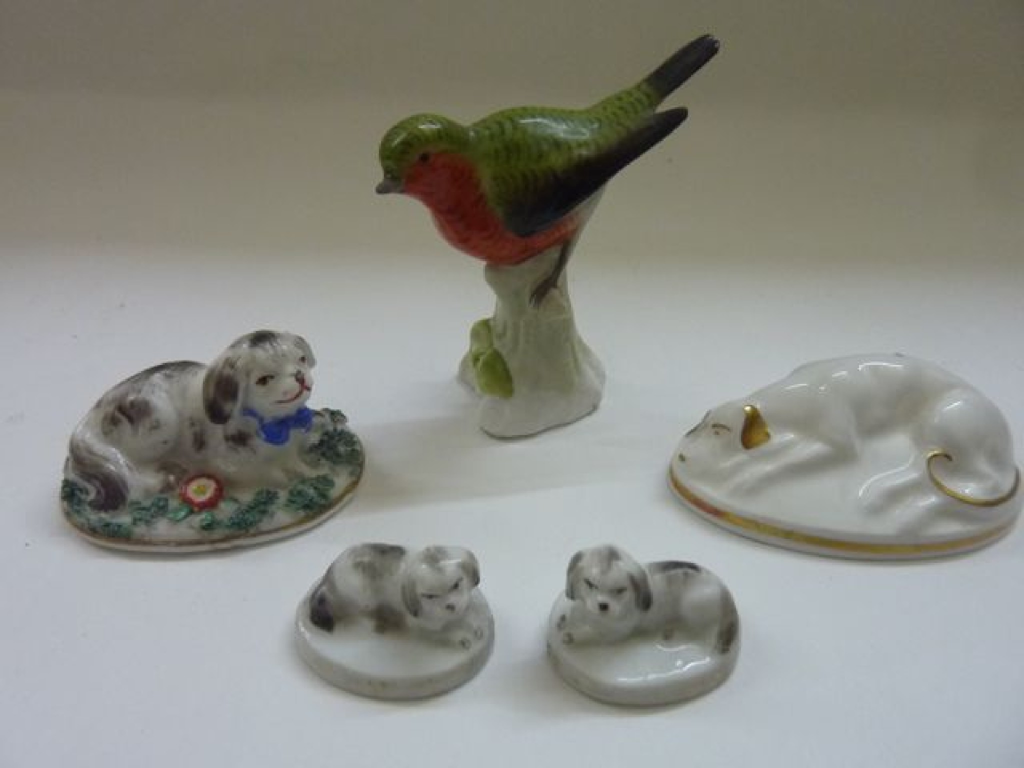 Appraisal: A continental porcelain figure of a red breasted finch together