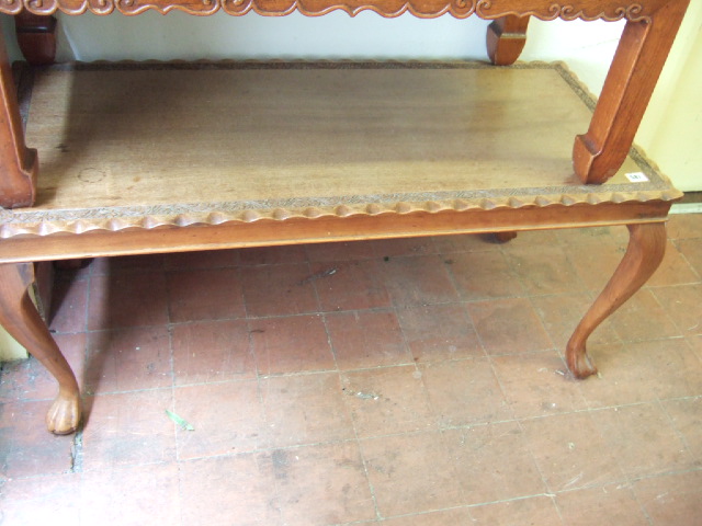 Appraisal: A th century hardwood coffee table with floral carved border