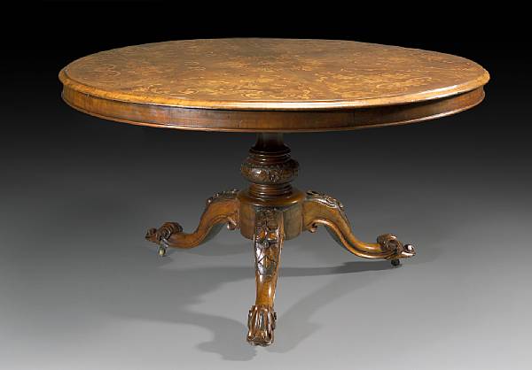 Appraisal: A Victorian walnut and marquetry tilt top breakfast table mid