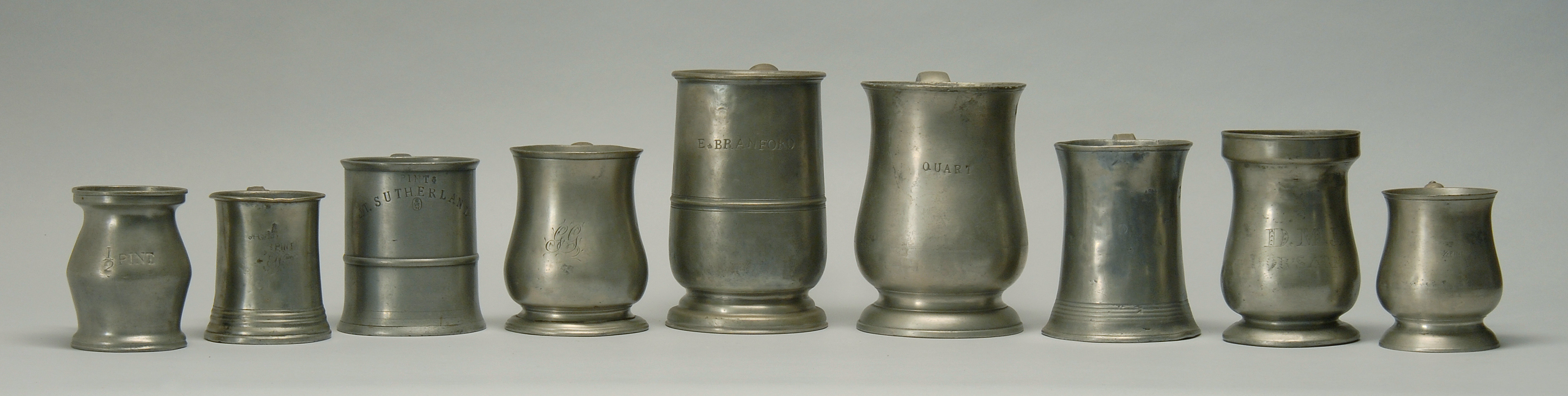 Appraisal: COLLECTION OF NINE ASSORTED ENGLISH PEWTER MEASURES th CenturyFrom half-pint