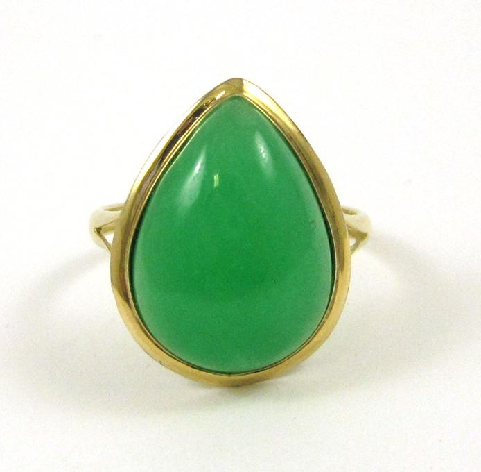 Appraisal: JADE AND FOURTEEN KARAT GOLD RING set with a single