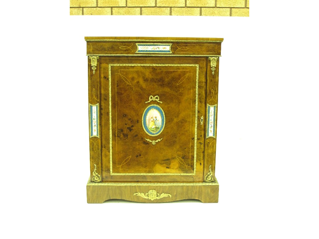 Appraisal: A walnut Pier Cabinet with satinwood stringing and inset Sevres