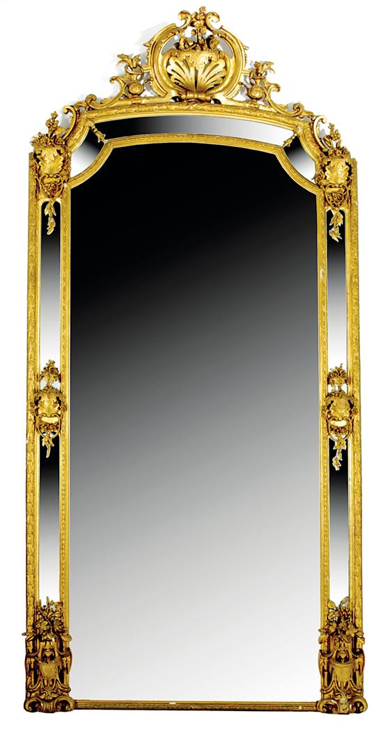 Appraisal: Monumental Continental carved giltwood pier mirror last half th century