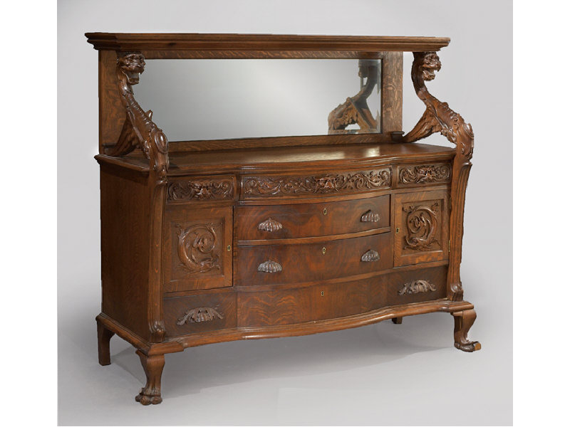 Appraisal: CONTINENTAL SIDEBOARD Griffin carved figures supporting upper shelf beveled edge