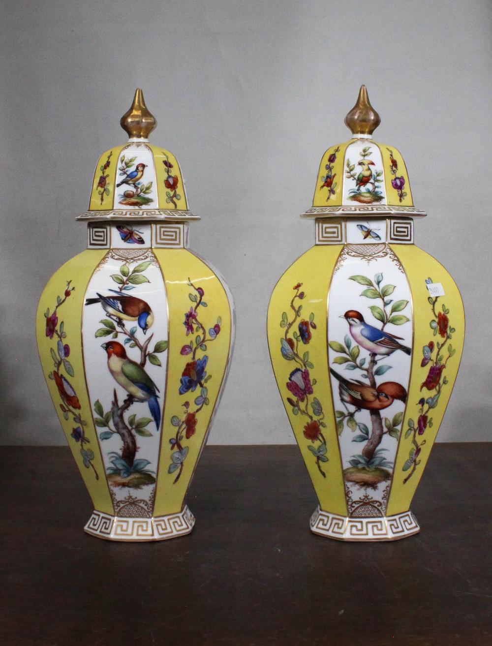 Appraisal: PAIR OF HAND PAINTED PORCELAIN LIDDED URNS octagonal form with