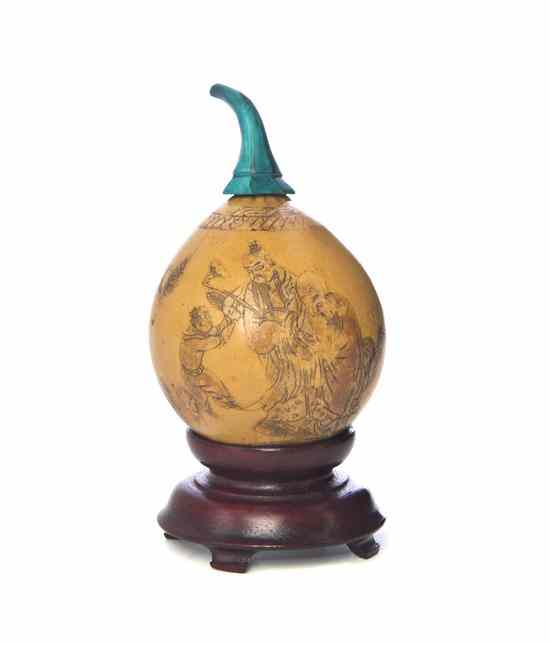 Appraisal: A Carved Gourd Snuff Bottle having carved decoration throughout of