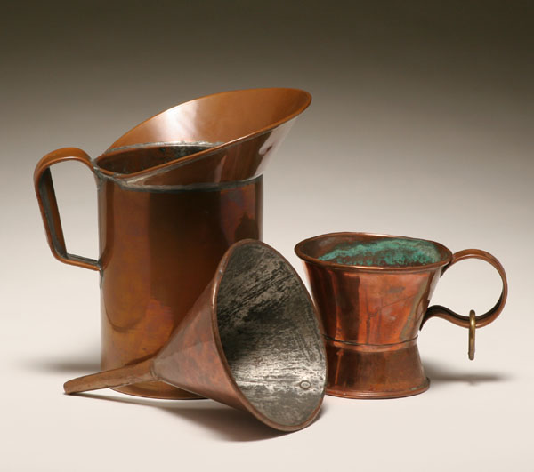 Appraisal: Two copper measuring pieces and one funnel tall handled can