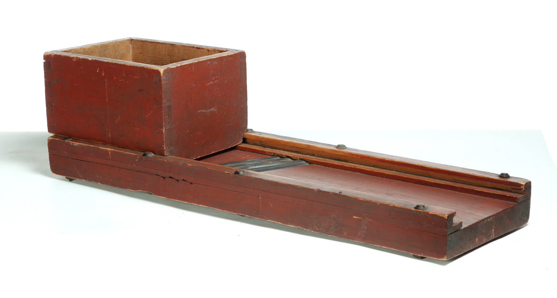 Appraisal: AMERICAN PAINTED SLAW CUTTER Nineteenth century pine Dovetailed sliding box