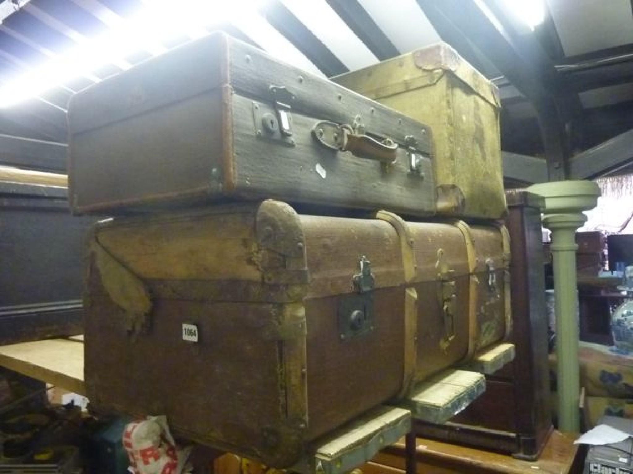 Appraisal: A vintage fibre and timber lathe bound cabin trunk a