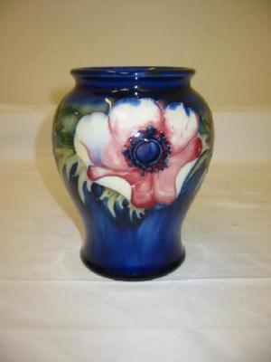 Appraisal: A WALTER MOORCROFT POTTERY VASE of baluster form tube lined