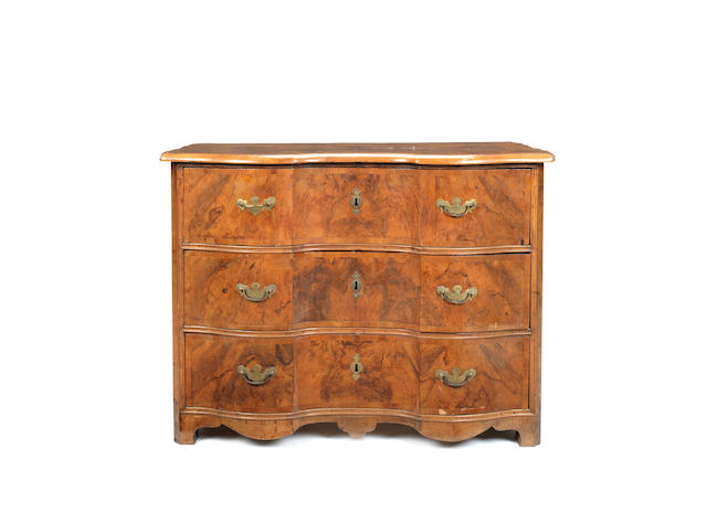 Appraisal: A German th century walnut and crossbanded serpentine commode the