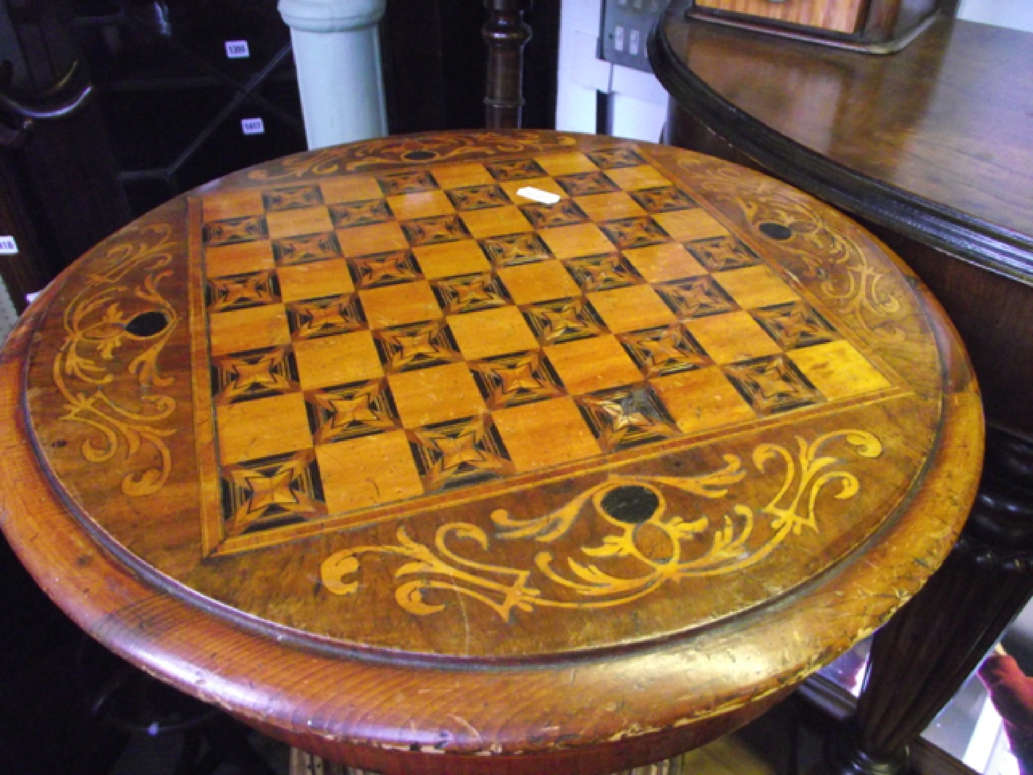 Appraisal: A Victorian walnut trumpet shaped workbox top with marquetry games