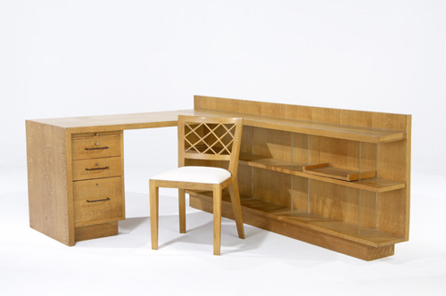 Appraisal: JEAN ROYERE Two-piece oak desk with three drawers pivoting shelf