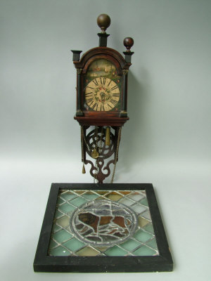 Appraisal: A 's oak painted dial wall clock in a pierced