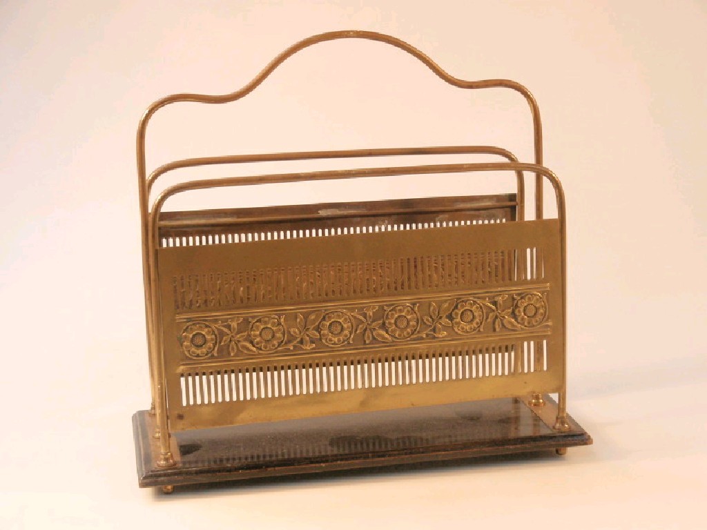 Appraisal: A brass magazine or music rack with rainceau borders on