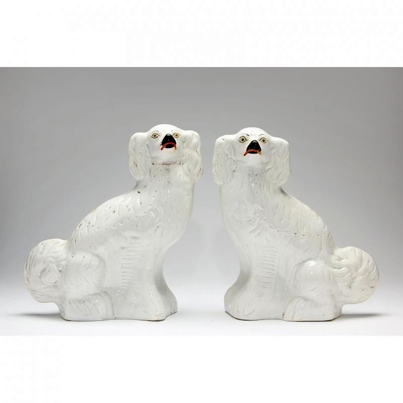 Appraisal: Pair of Staffordshire Spaniels th century white with gilt painted