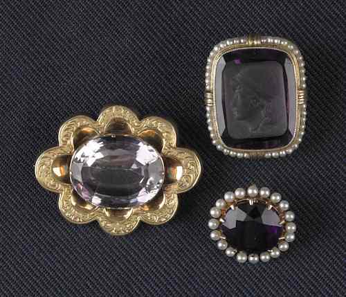 Appraisal: Three K yellow gold and amethyst brooches to include seed